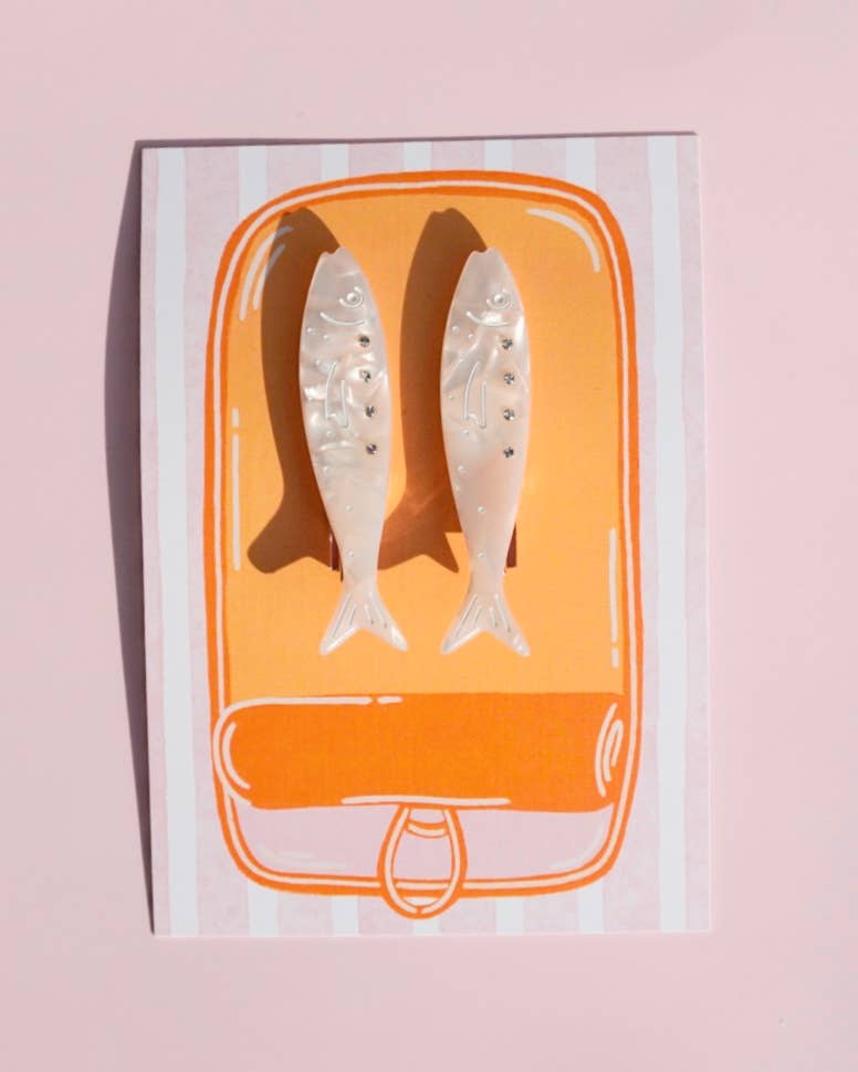 Illustration of fish in a box on a pink background