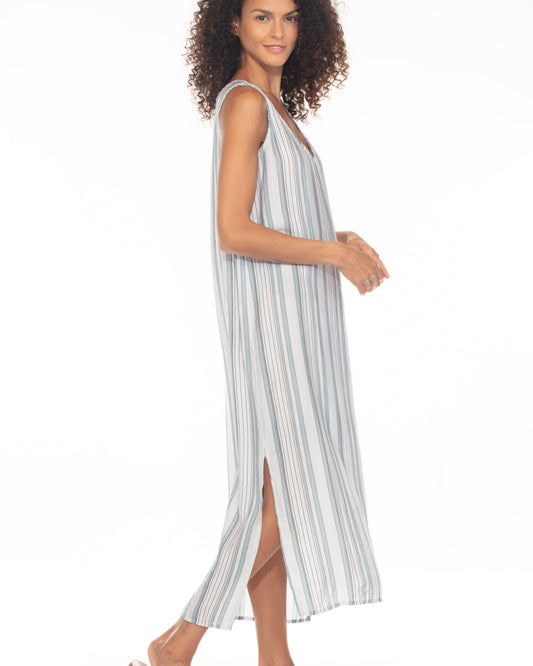 Woman wearing a striped dress on a white background