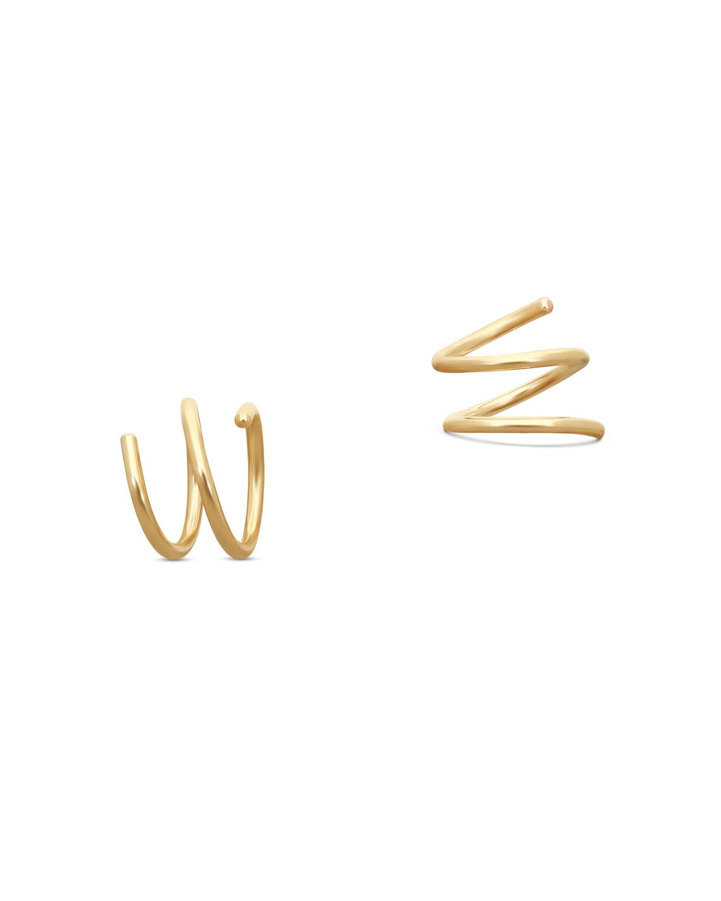 Gold spiral earrings on a white background