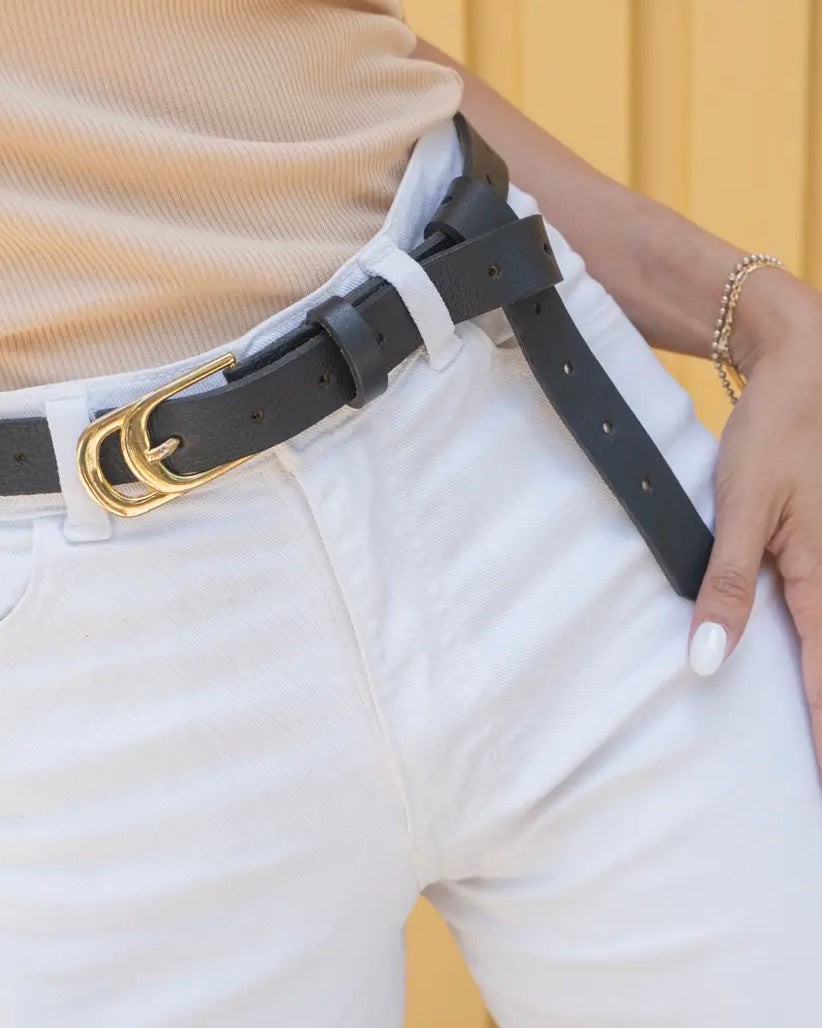 Photo of the Ada Infinity leather belt worn with white jeans.