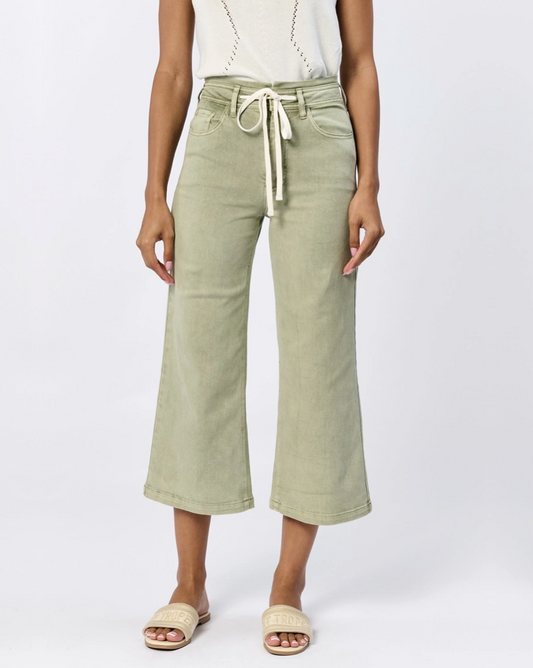 Front view of the Dear John Denim Audresy wide leg jean in sage worn by a model standing in front of a white background