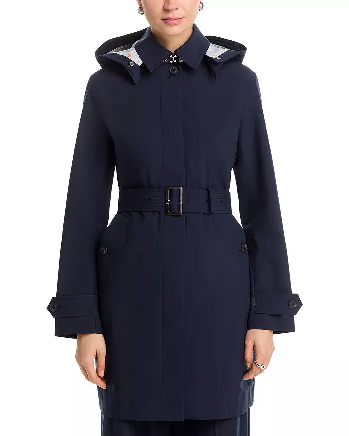 Front view of the Save the Duck Jackie Raincoat on a model in front of a white background.