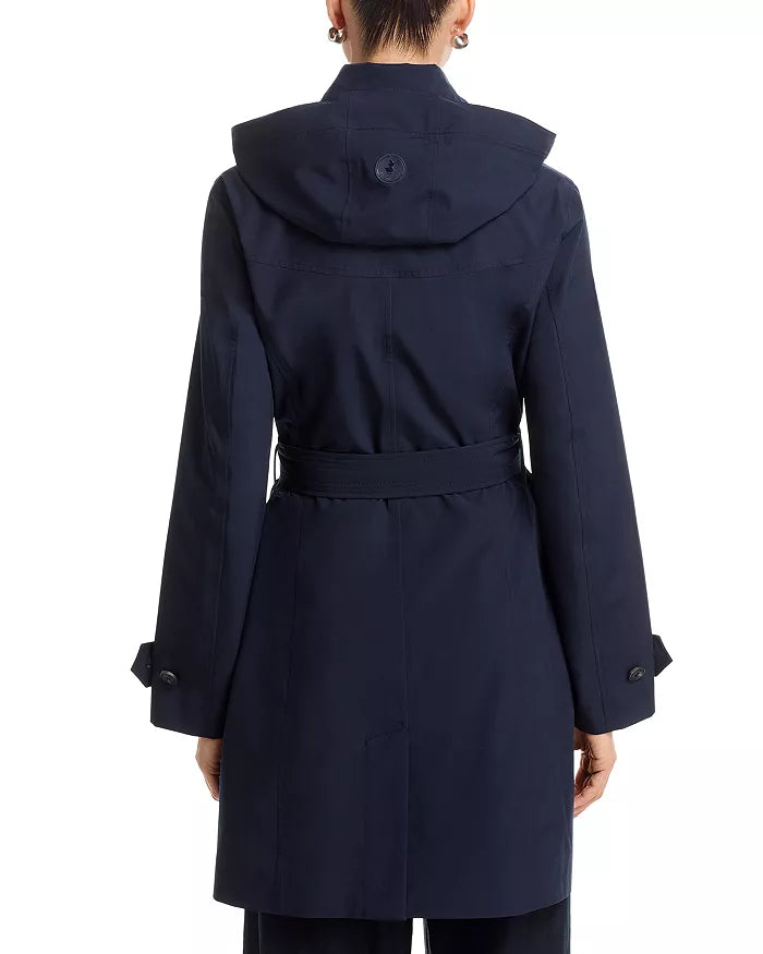 Back view of the Save the Duck Jackie raincoat on a model standing in front of white background.