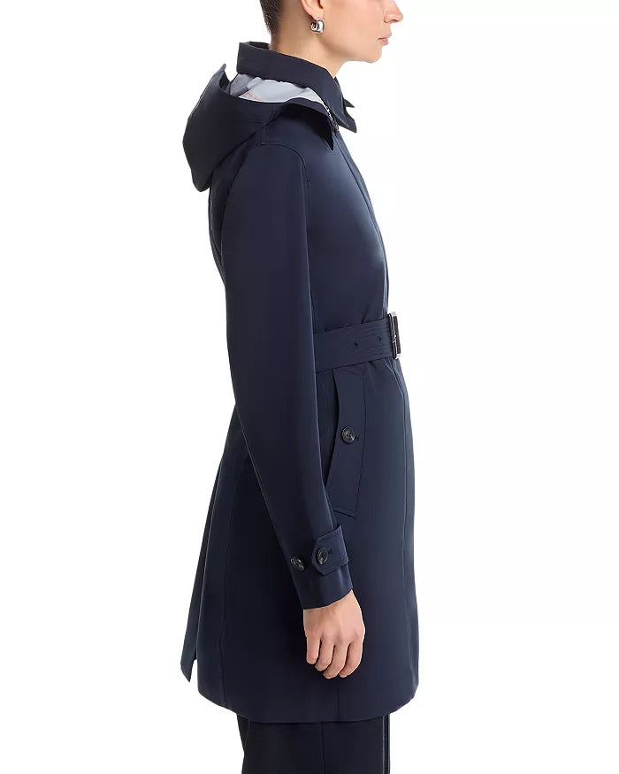 Side view of the Jackie raincoat by Save the Duck on a model in front of a white background.