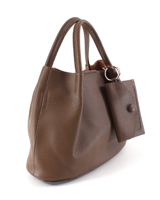 Brown leather handbag with a tag on a white background