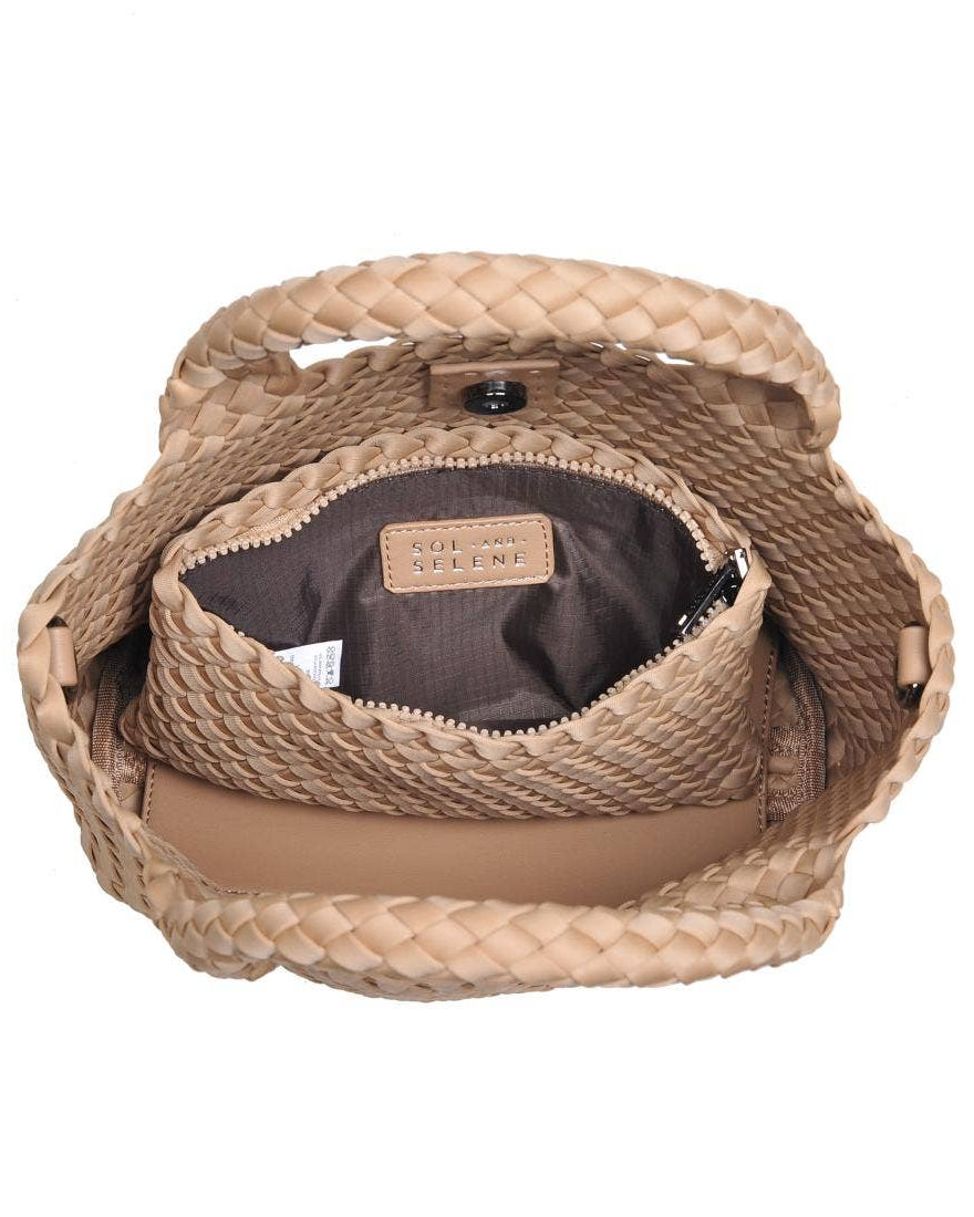 Woven handbag with visible brand name on a white background