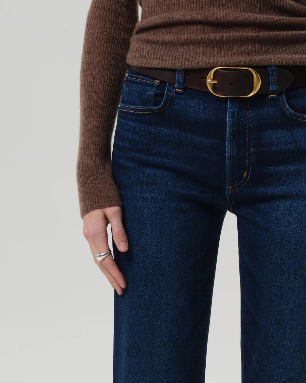 Close up view of a model wearing the Citizens of Humanity Palma Straight Leg Jeans in Dakota on a white background.