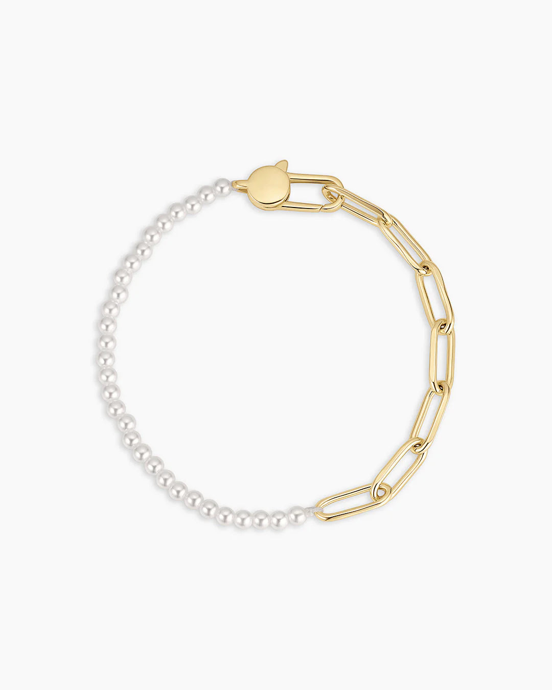 Gold and pearl bracelet on a white background