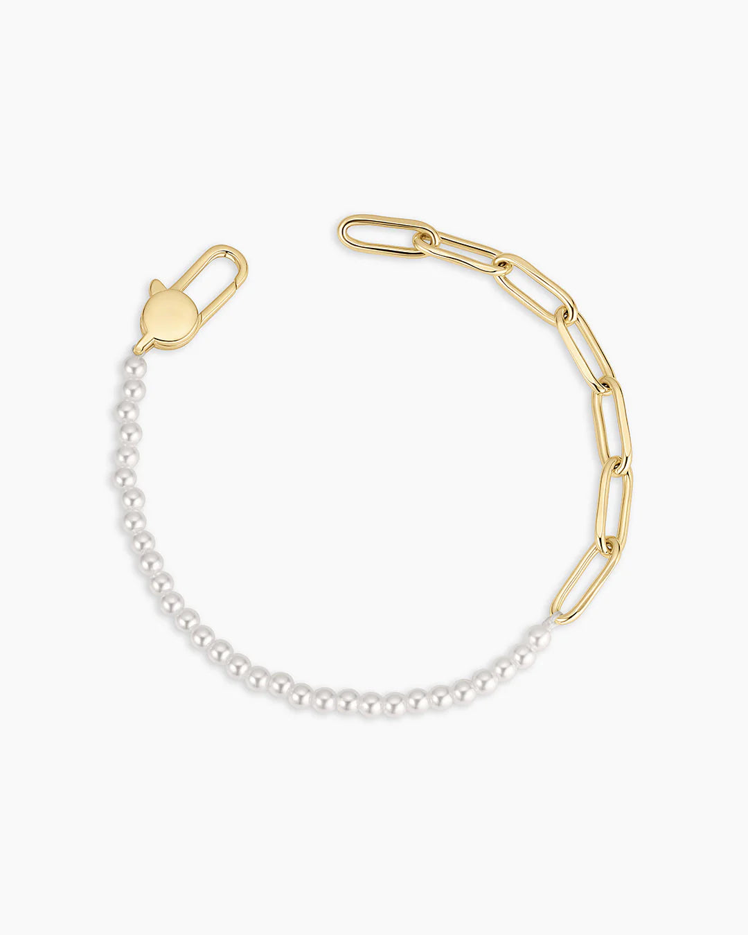 Gold and pearl bracelet on a white background
