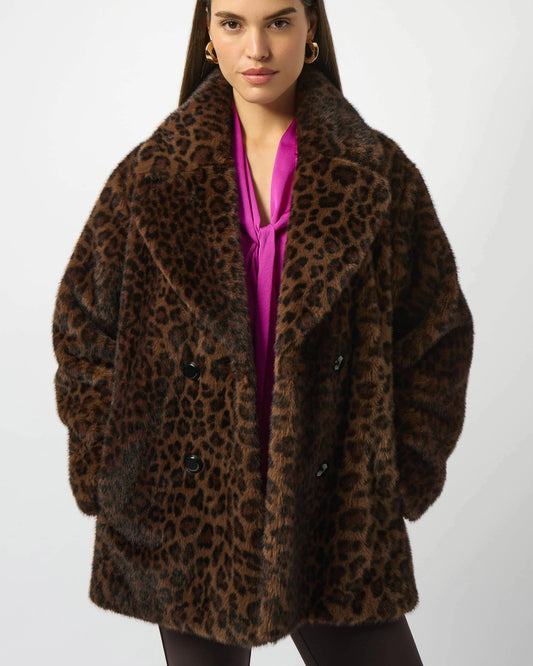 Woman wearing a leopard print coat on a white background