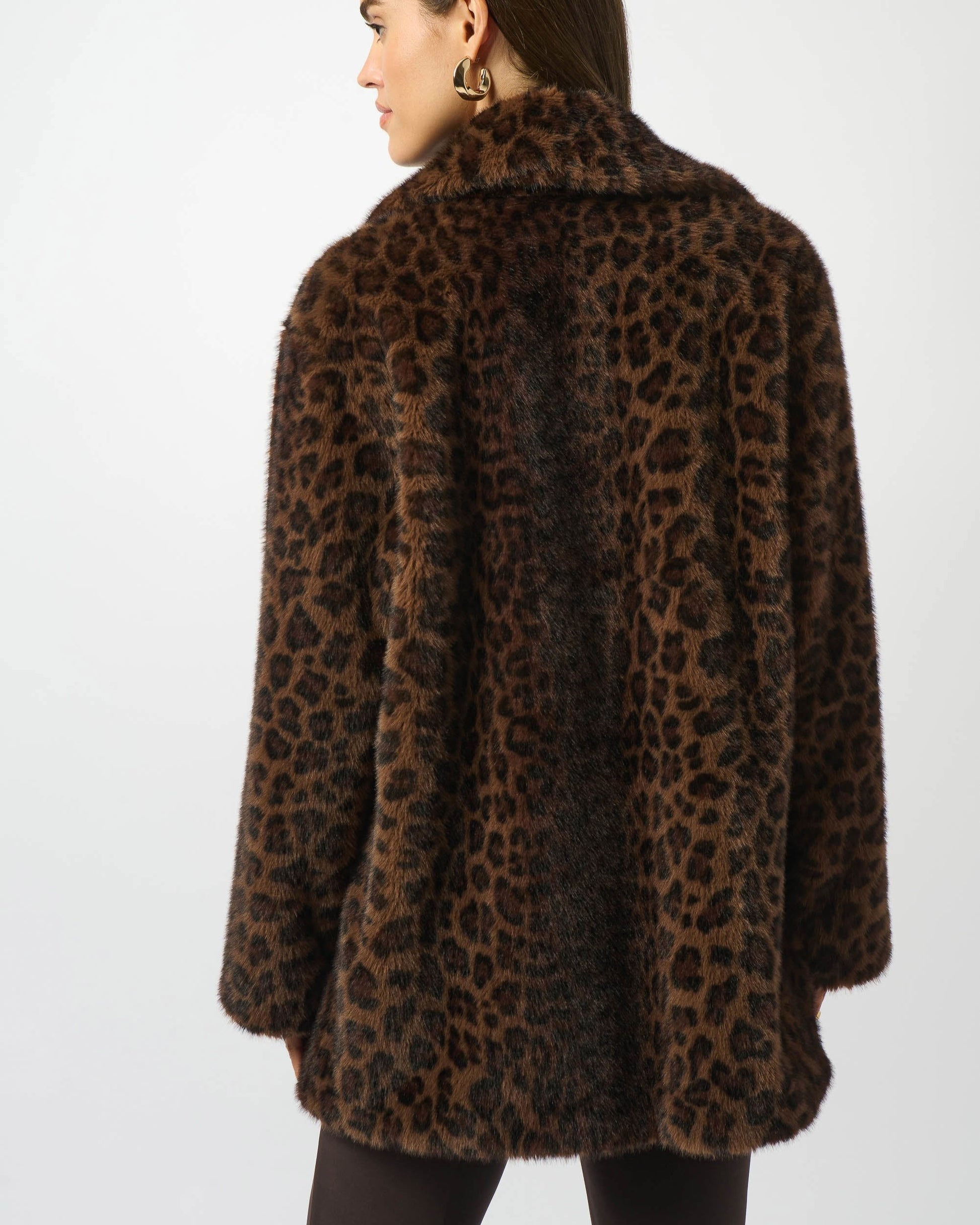 Leopard print coat worn by a person on a white background