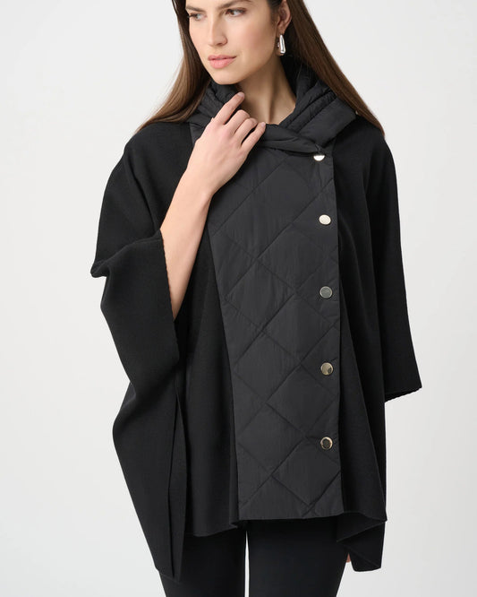 Woman wearing a black quilted jacket with a hood on a white background