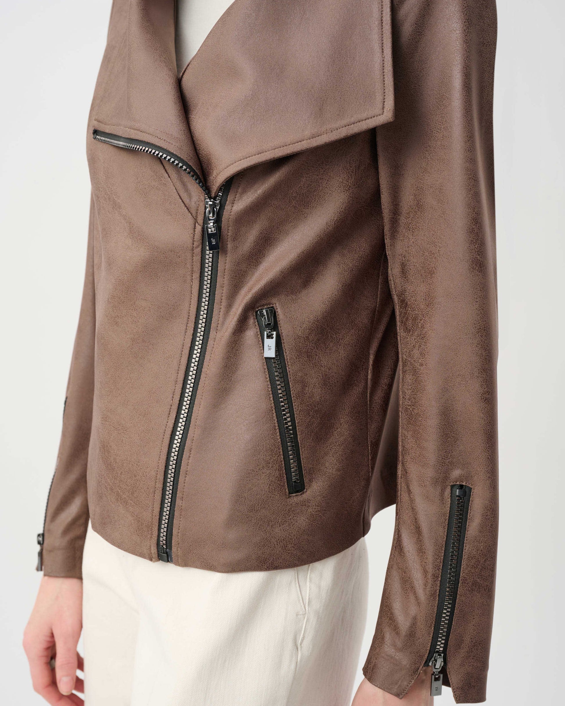 Brown leather jacket with zippers on a white background