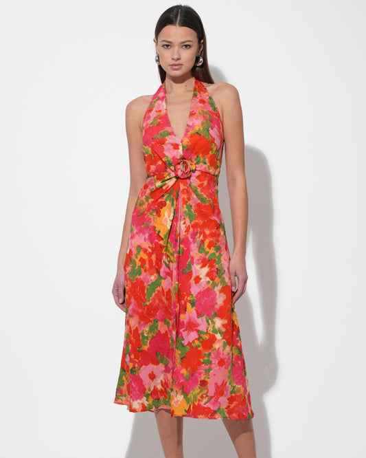 Model in the Hatrina Halter Midi Dress with Rosette in front of a white background.