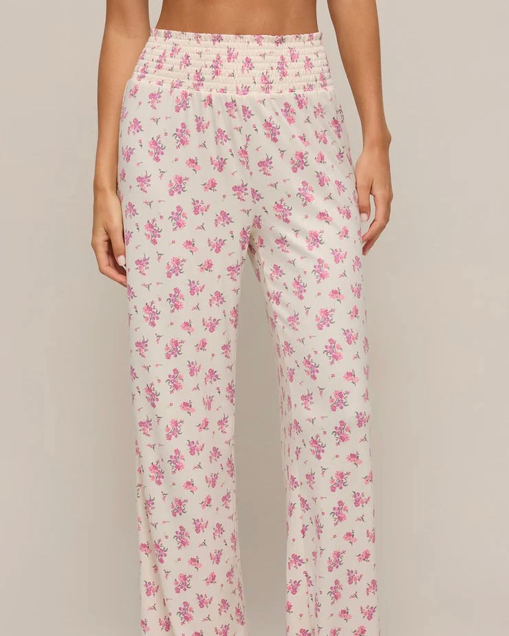 Front view of the Z Supply Dawn Ditsy Pointelle Floral Pant worn by a model standing in front of a white wall.