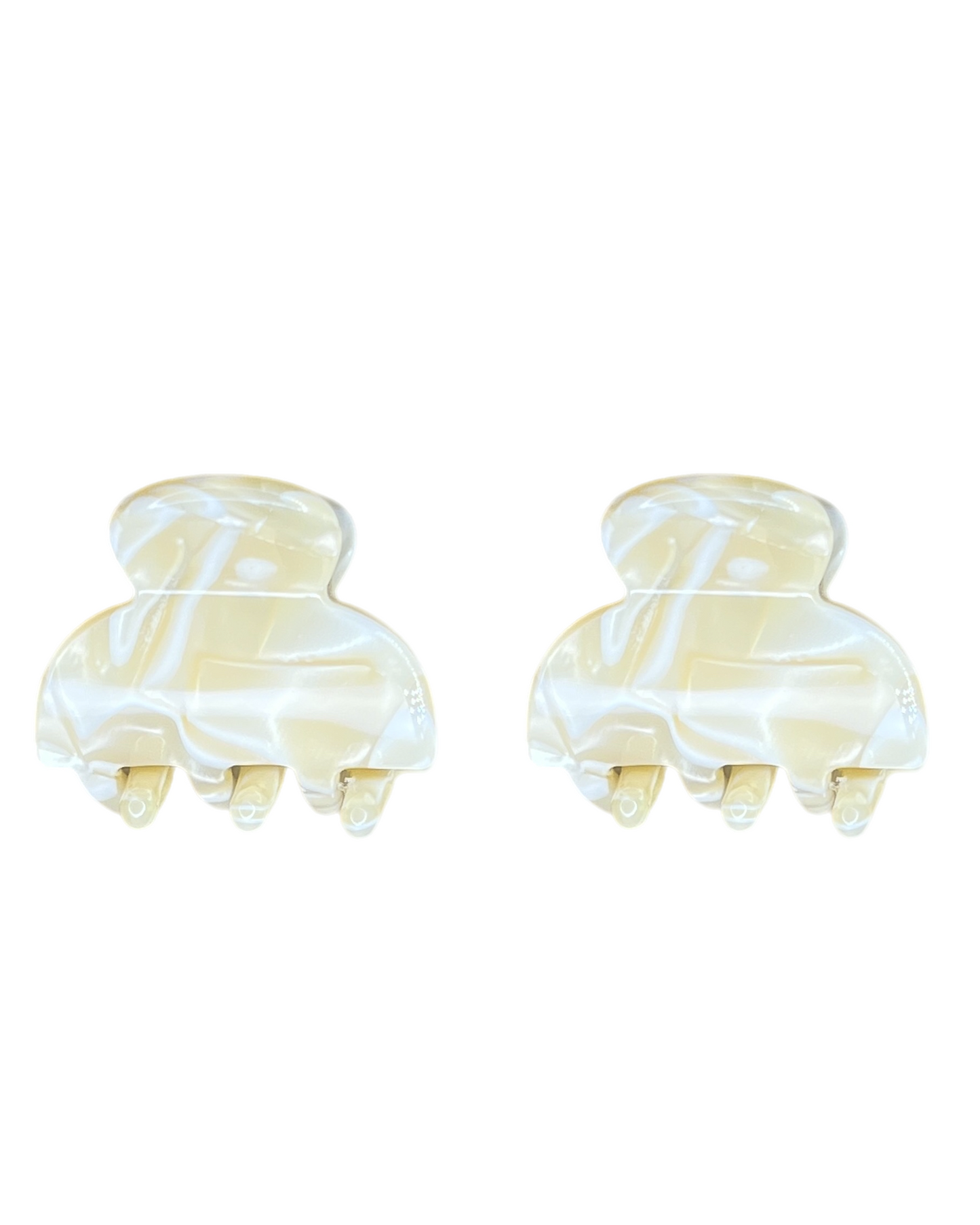 Two marbled hair clamps on a white background