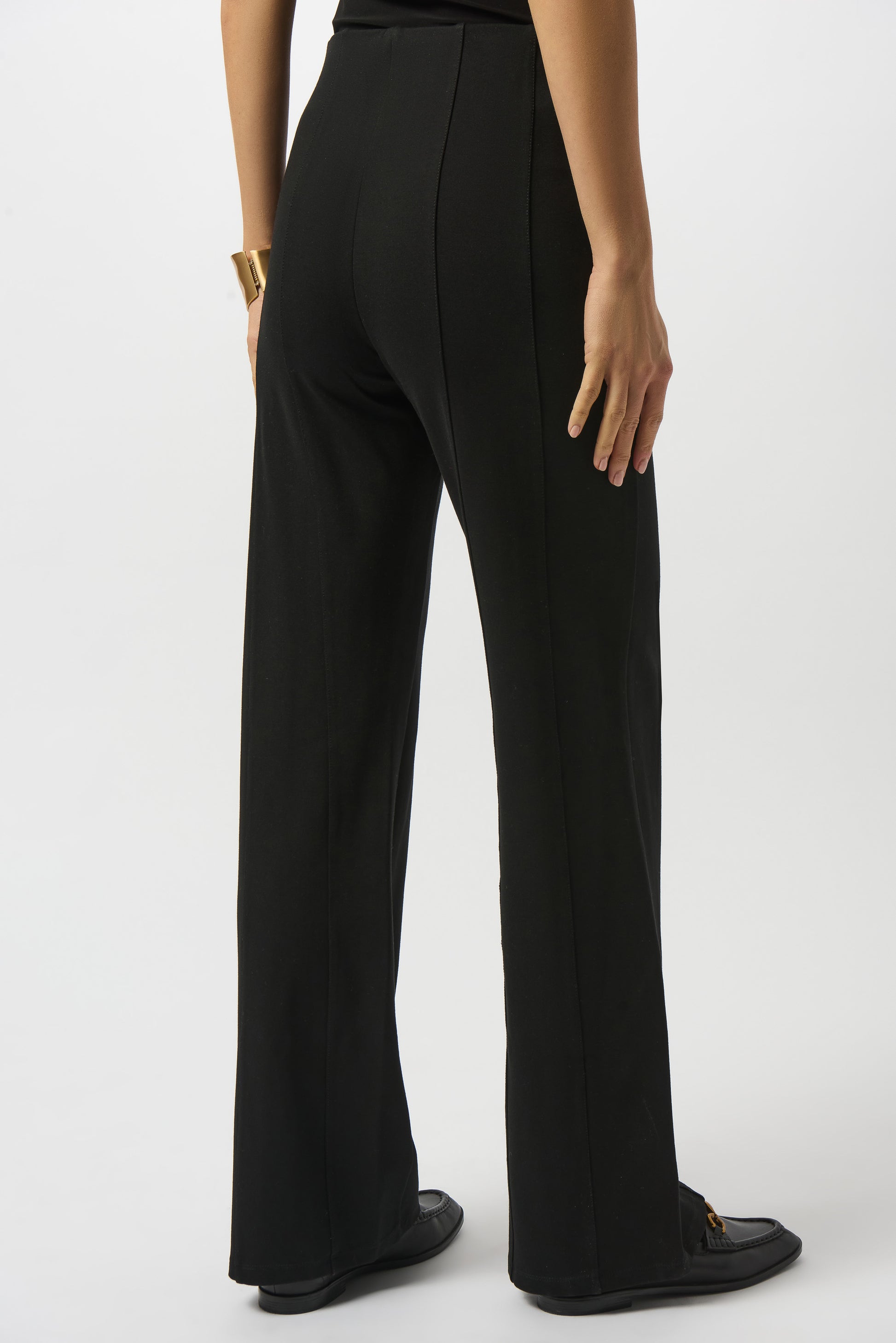 Model is wearing Joseph Ribkoff Heavy Knit Wide Leg Pull-On Pants in black on a white background