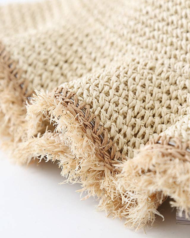 Close-up of beige textured fabric on a white background