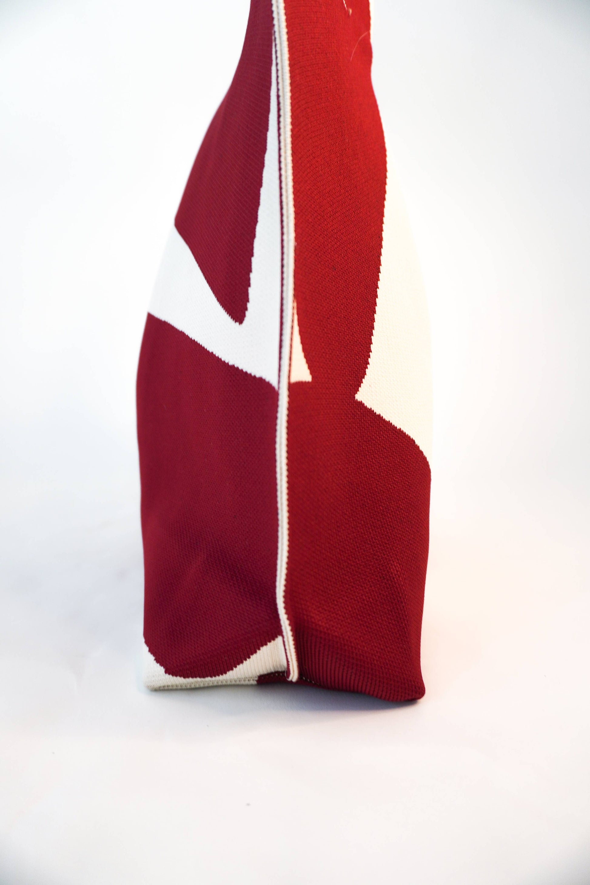 Red and white striped fabric on a white background