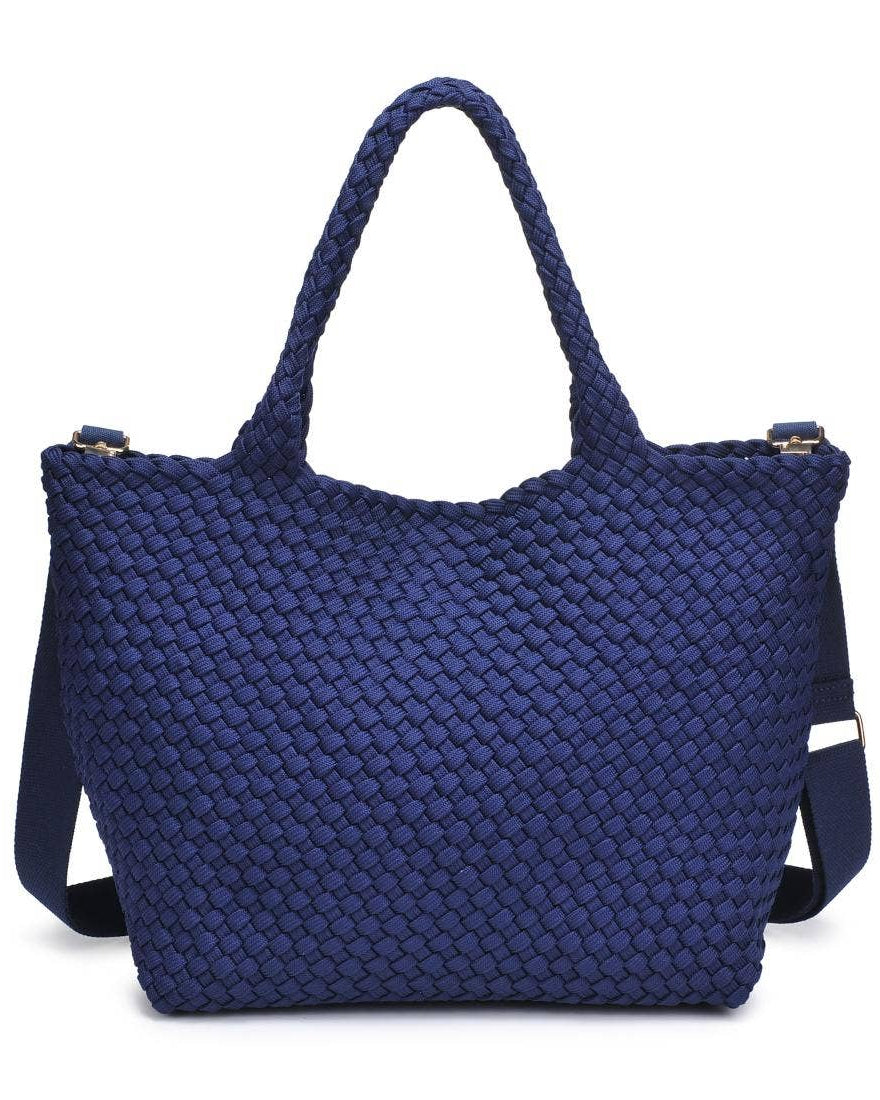 Blue woven handbag on a white background