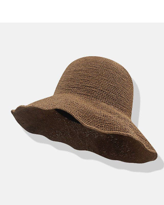 Brown straw hat on a white background