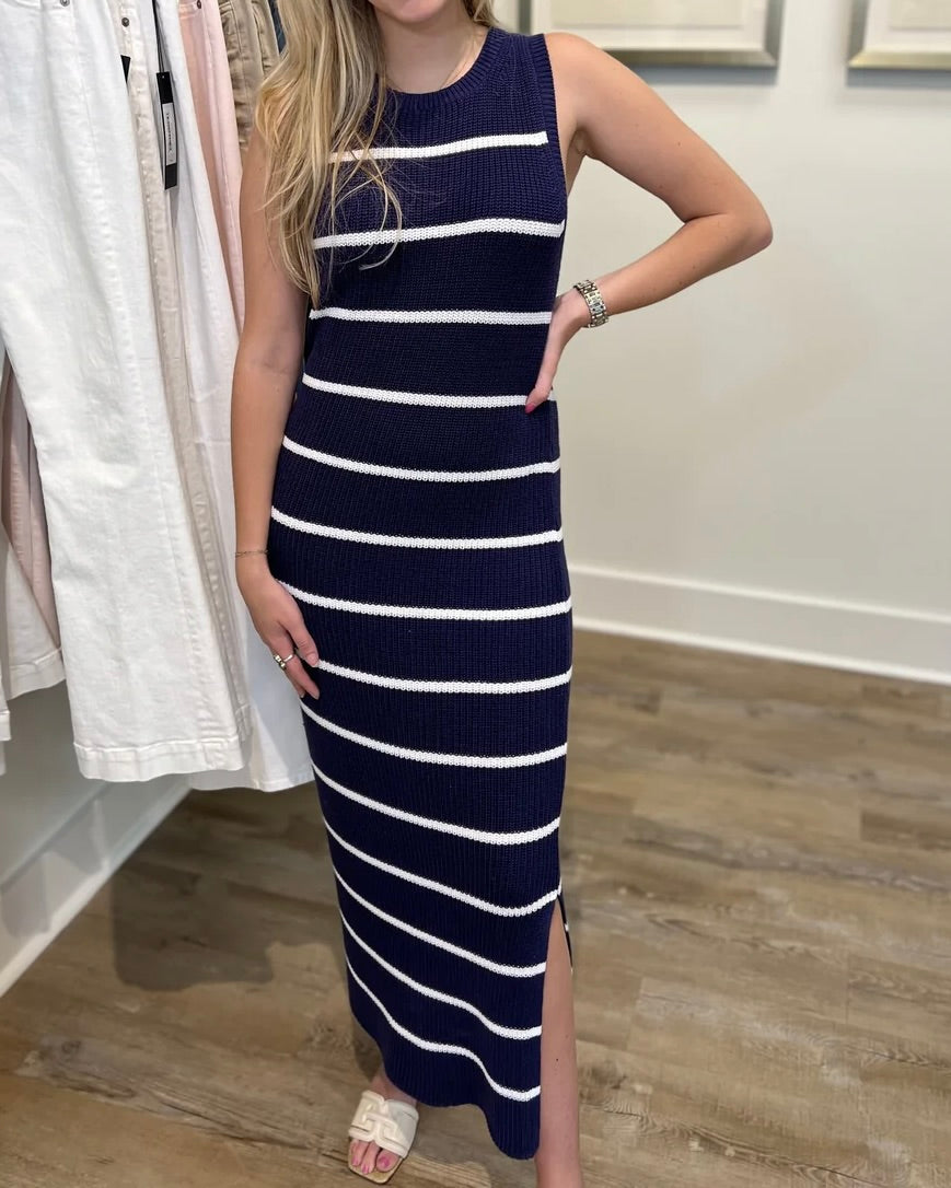 Model wearing 525 Emma Navy/white stripe Midi Dress with her hand on her hip