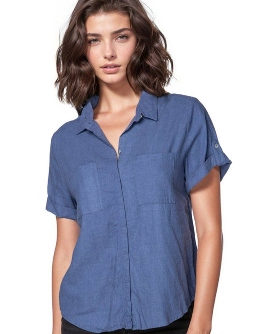 Woman wearing a blue short-sleeve shirt on a white background
