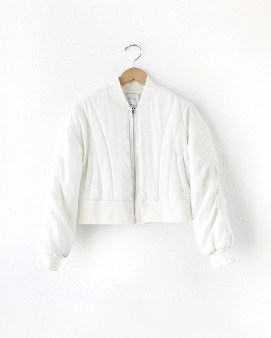 Image of White Bomber Jacket made by Greylin on a coat hanger and white background
