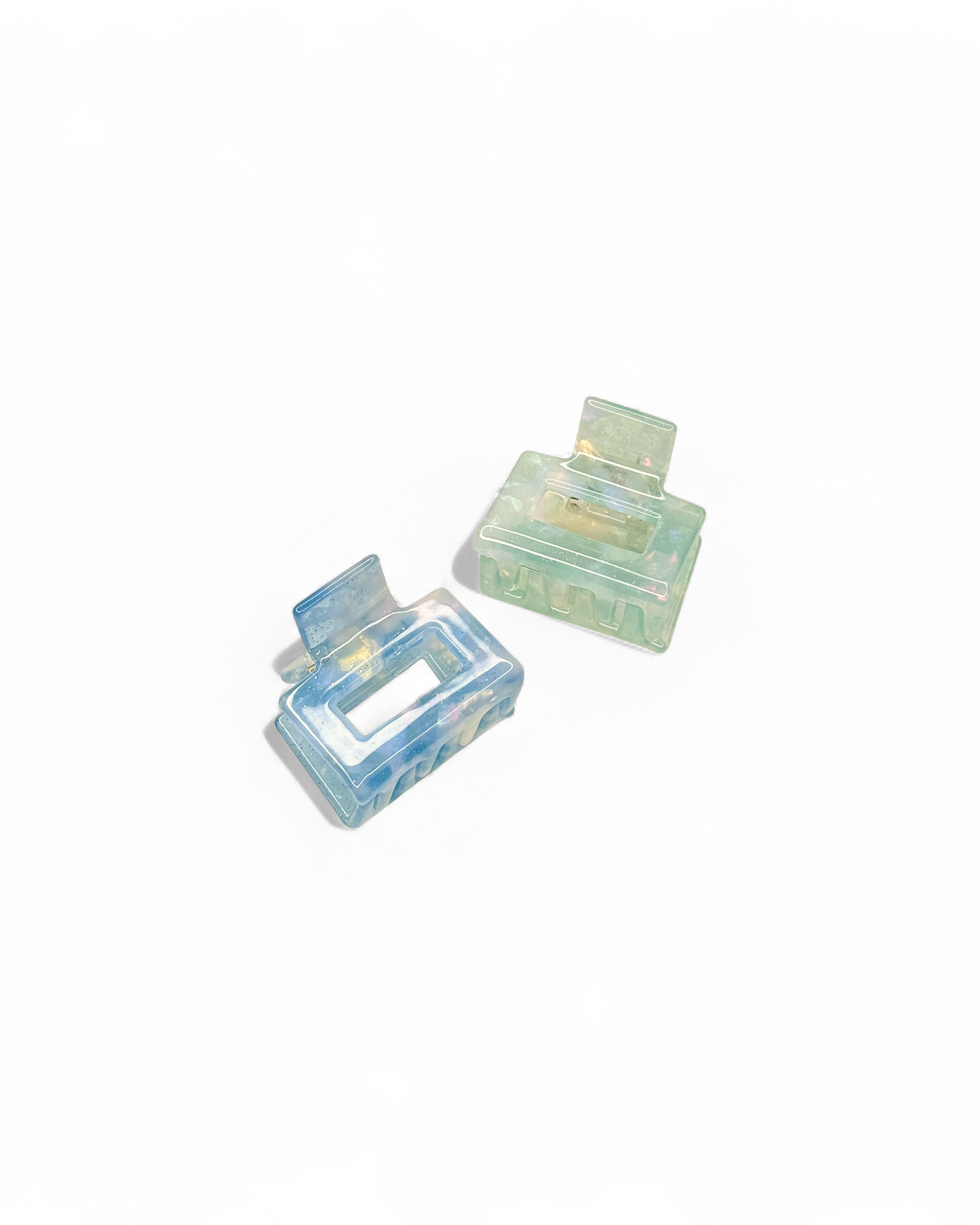 The HoneyLux Acetate Mini Square Claws clips in the color mist on a white background