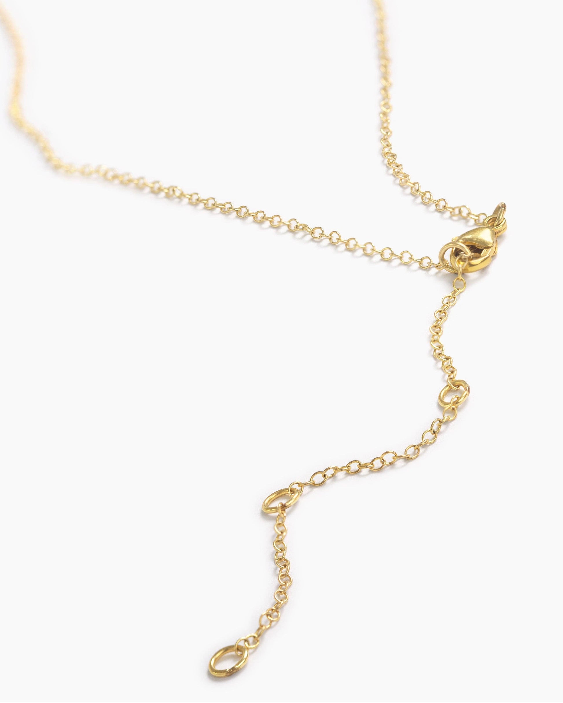 Gold necklace on a white background