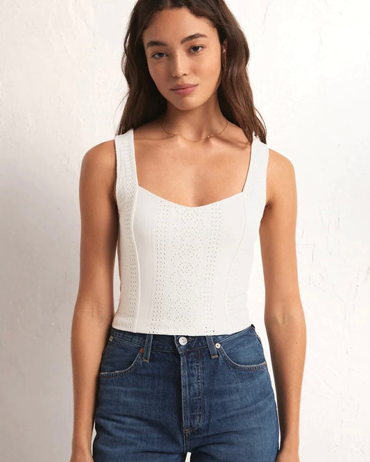 Model Wearing Z Supply Zaria Knit Eyelet White Top wearing jeans on a white background