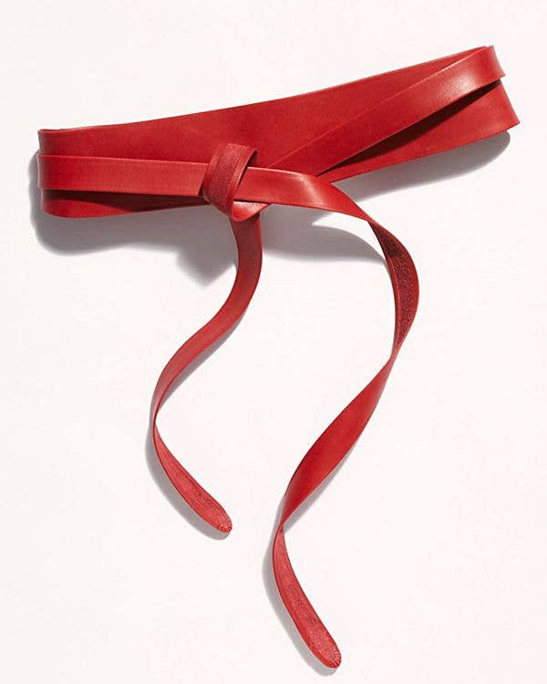 Red belt with a bow on a white background