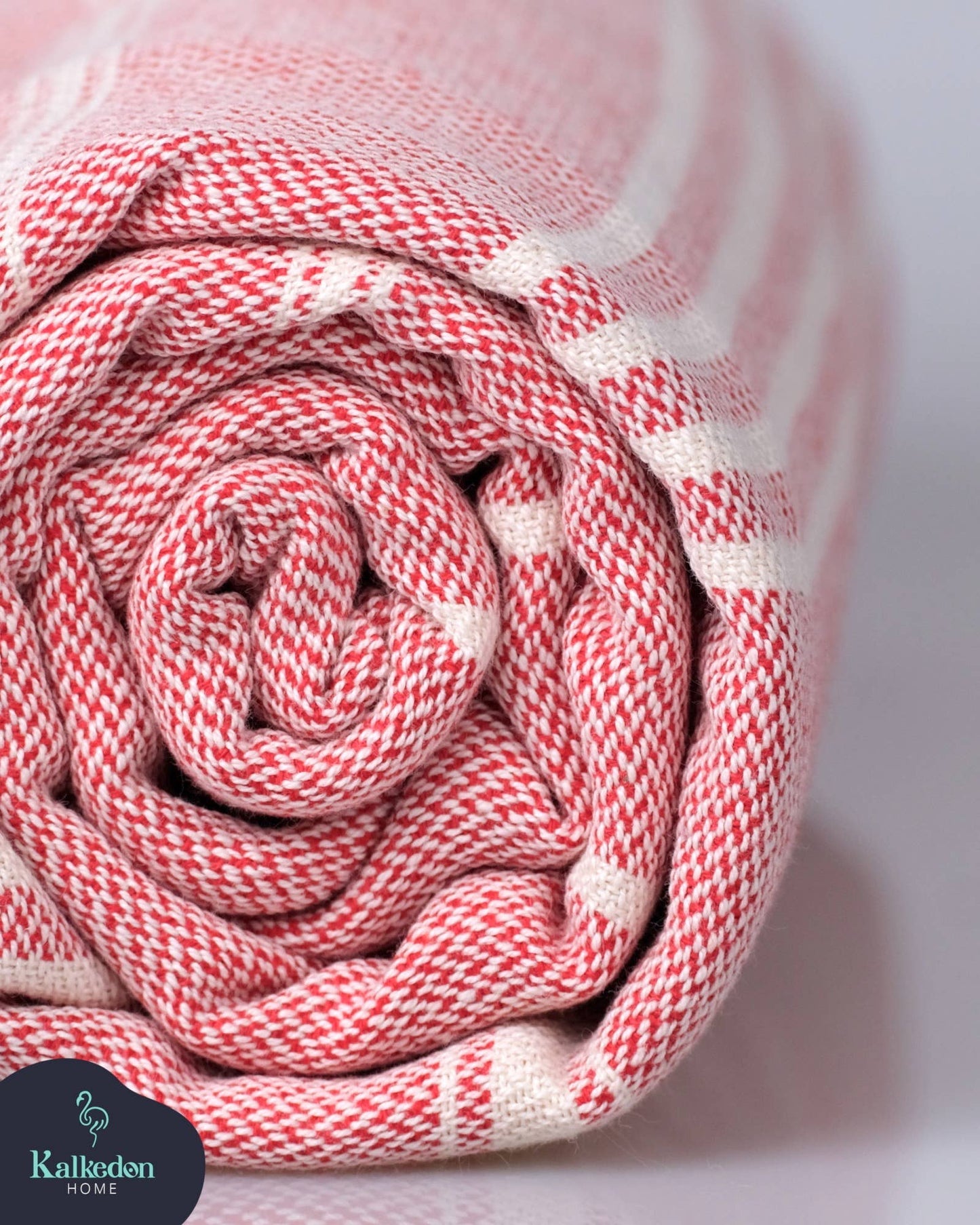 Rolled-up red and white fabric with a blurred background