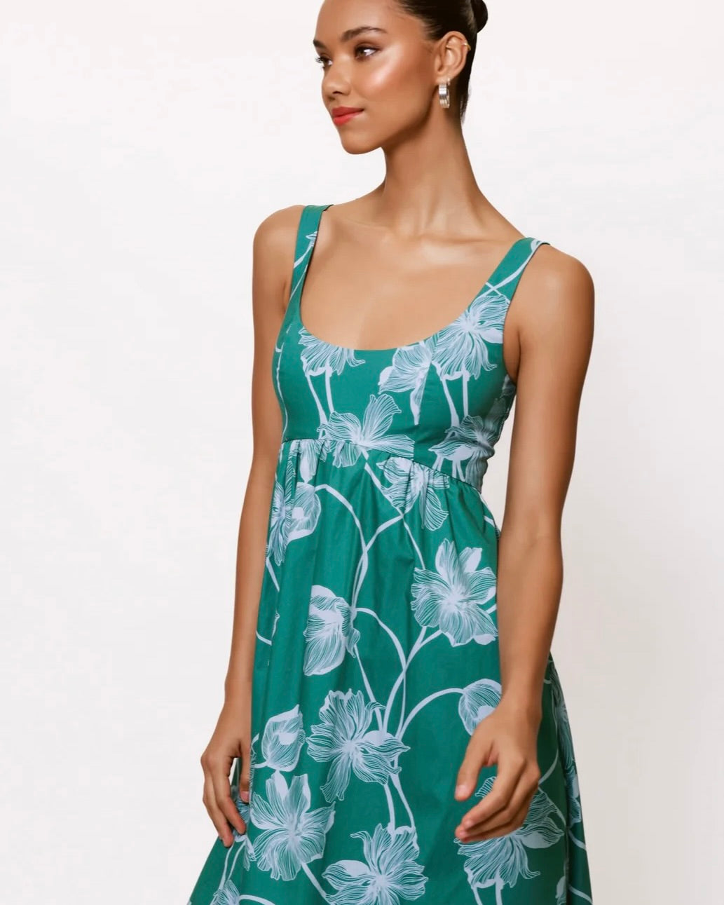 Model is wearing Hutch Arley Midi Dress in Teal/Sky on a white background. 