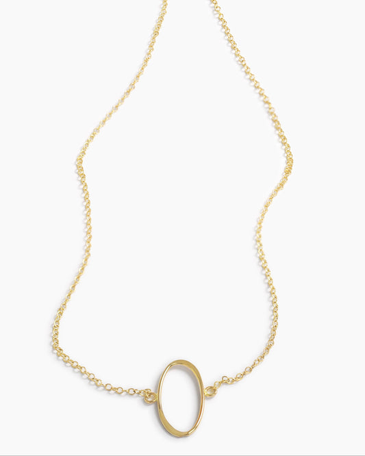 Gold necklace with a unique pendant on a white background
