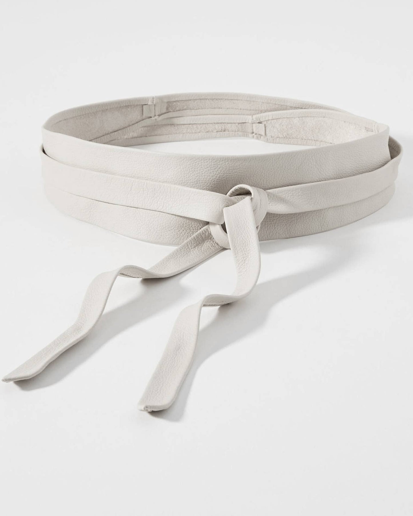 White belt with a bow on a white background