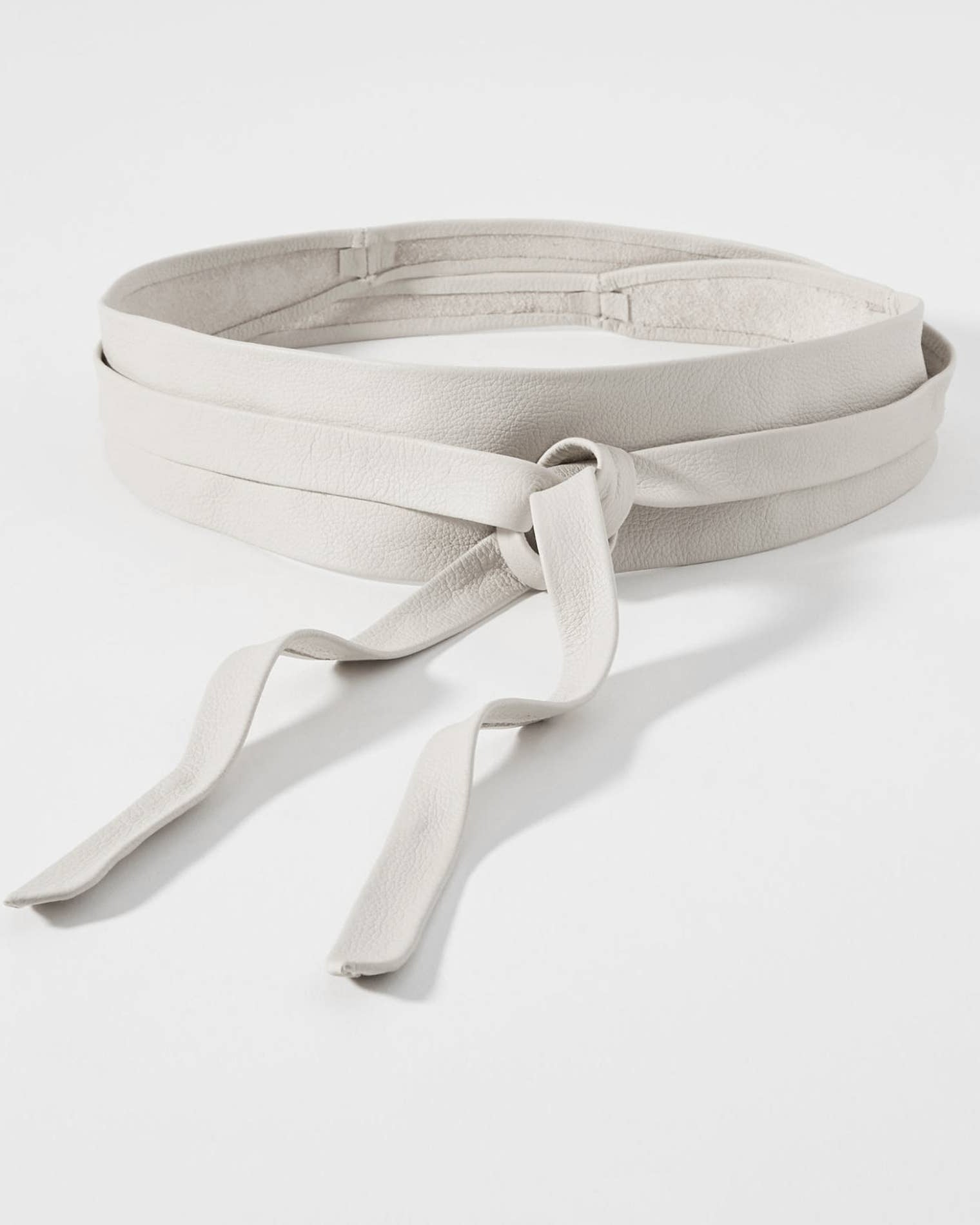 White belt with a bow on a white background