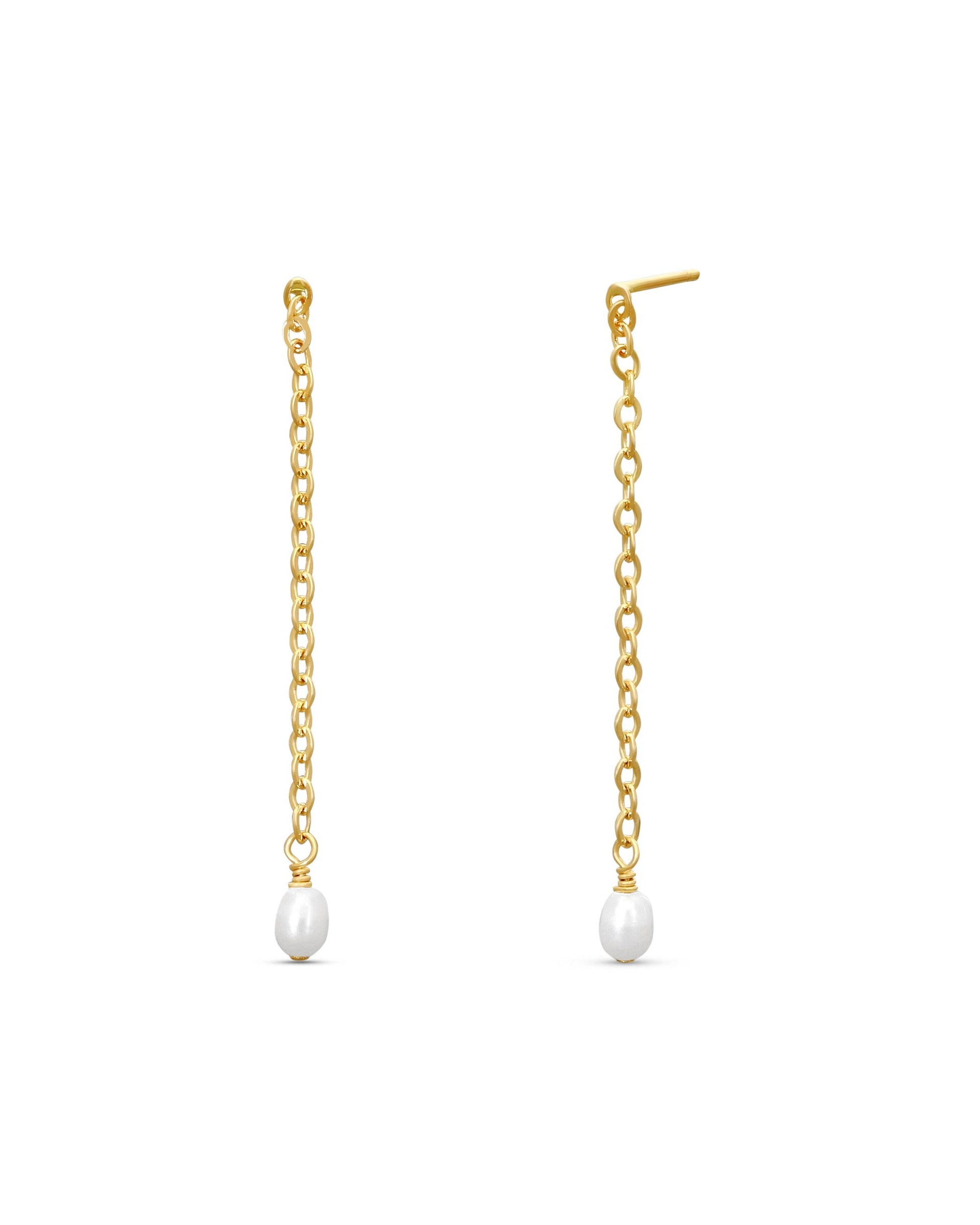 Gold chain earrings with pearl drops on a white background