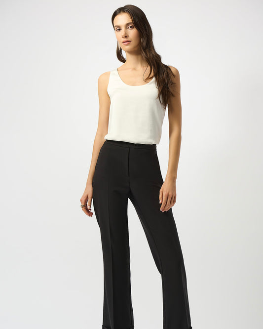 Model is wearing Joseph Ribkoff Recycled Hammered Satin Sleeveless Top in winter white on a white background