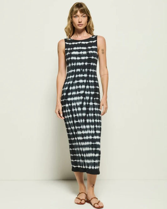 Model wearing the Nation Tie Dye Dress with sandals posing in front of a neutral background.