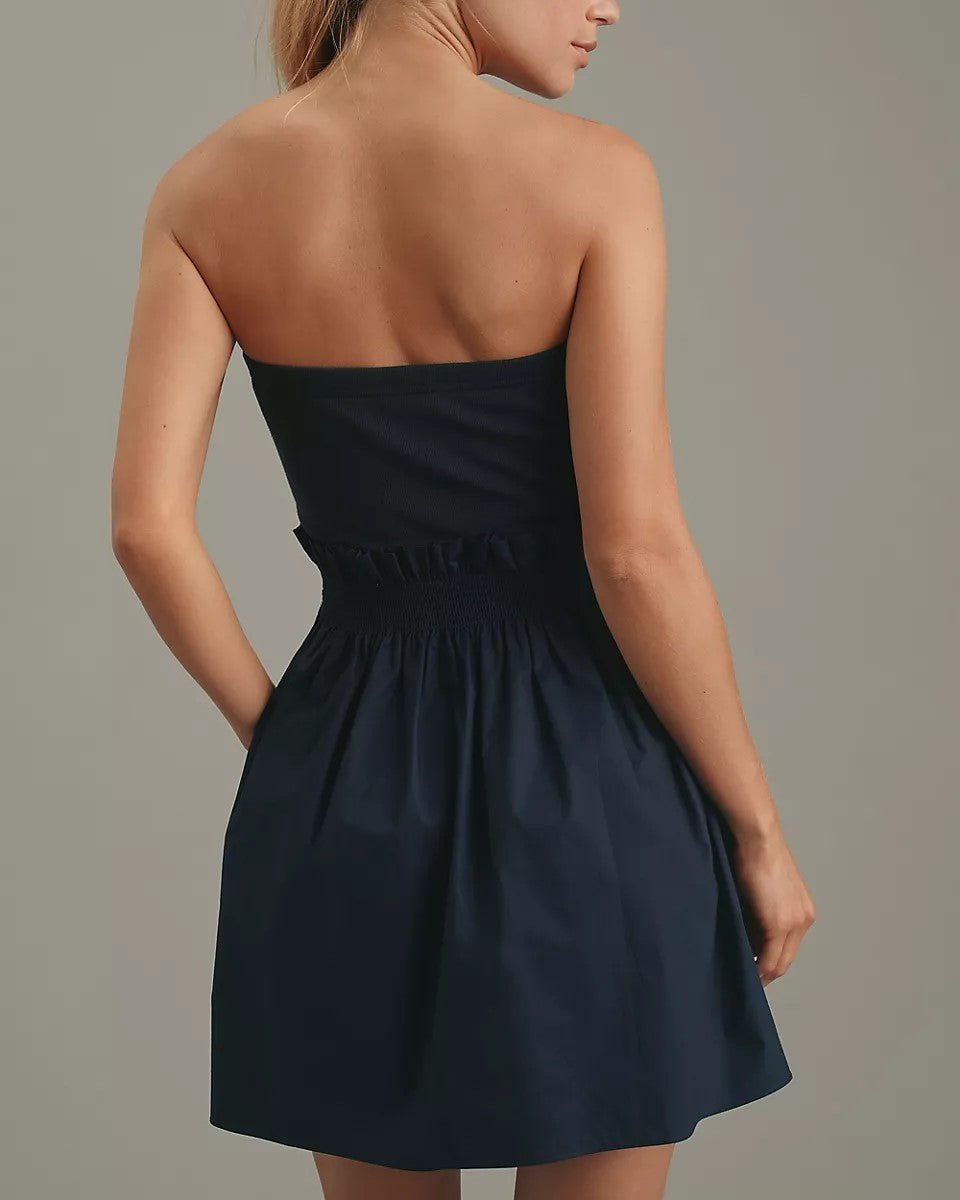 backside image of Sundays Adella Dress in navy on a gray background