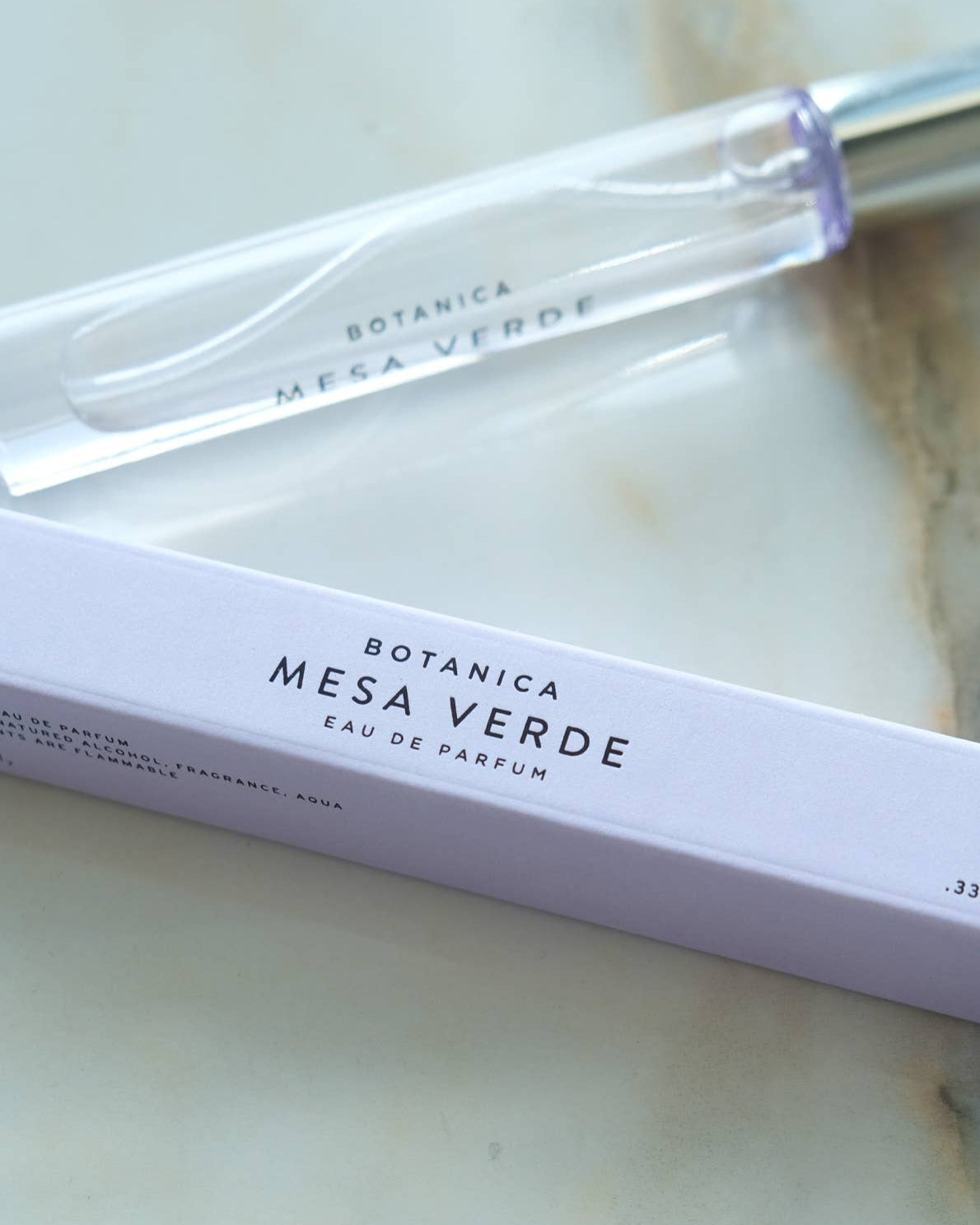 Mesa Verde Botanica perfume packaging on a marble surface