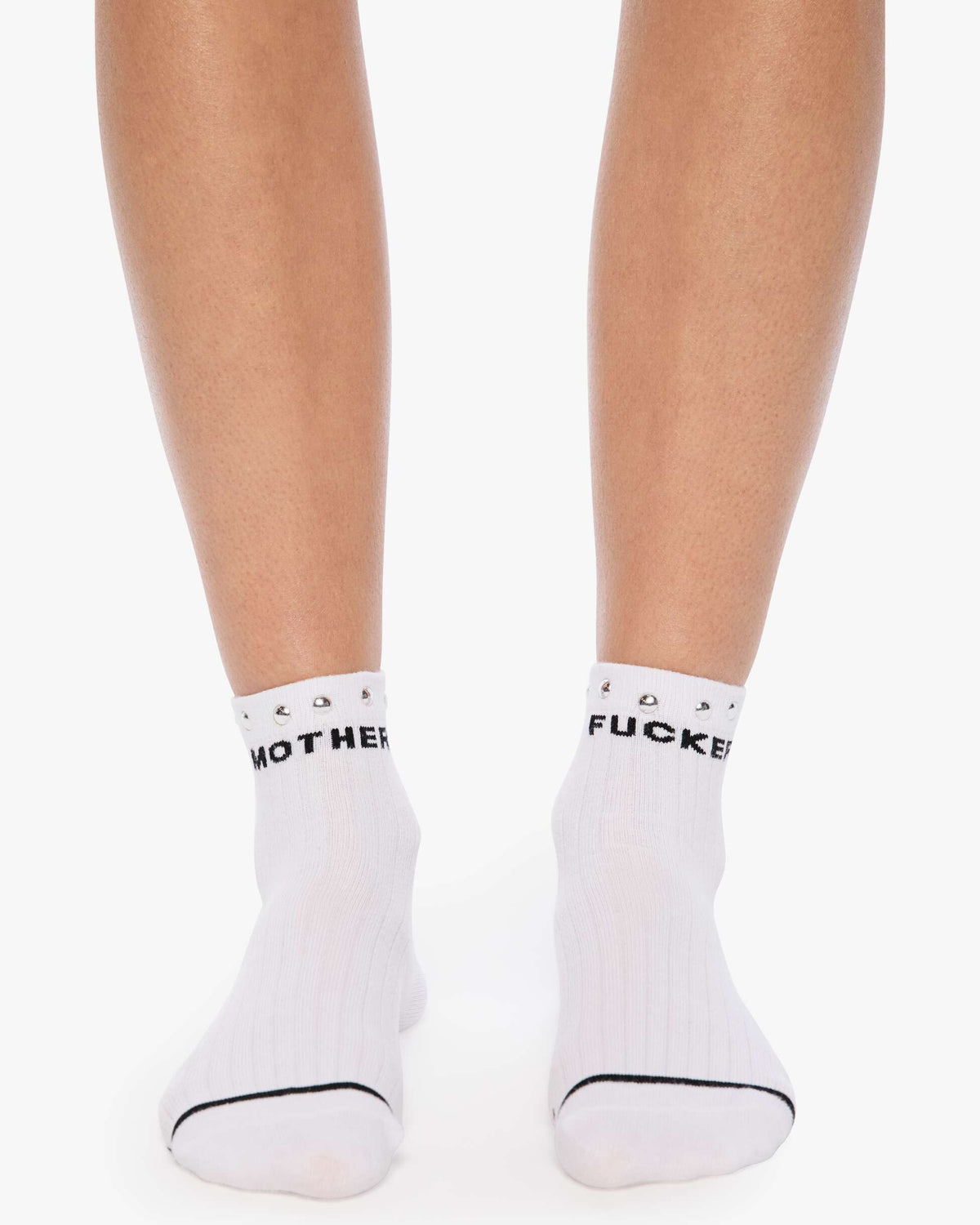 White socks with black text worn by a person on a white background