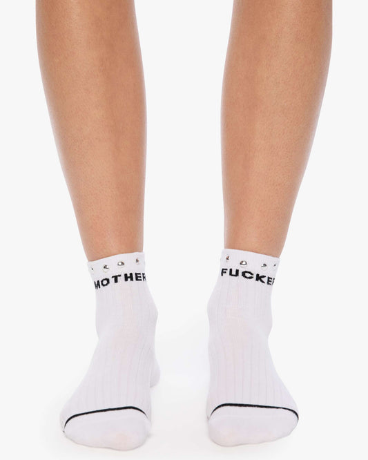 White socks with black text worn by a person on a white background