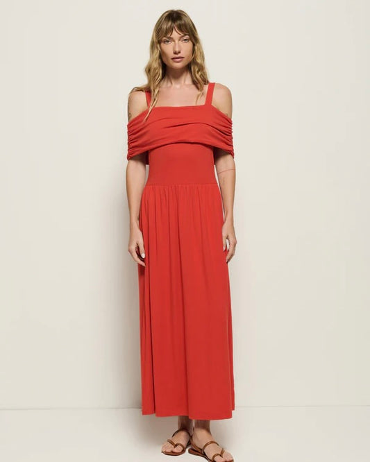 Front view of the Nation Tamaira Dress on a model standing in front of a white wall.