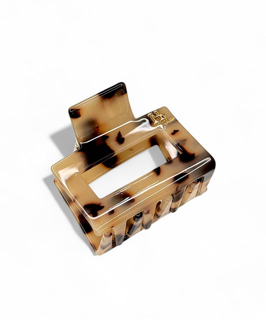 Tortoiseshell hair clip on a white background