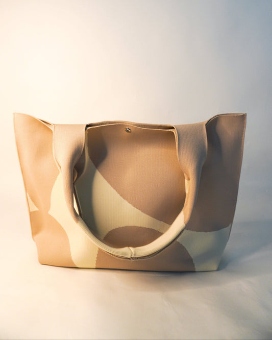 Beige tote bag on a light gray background