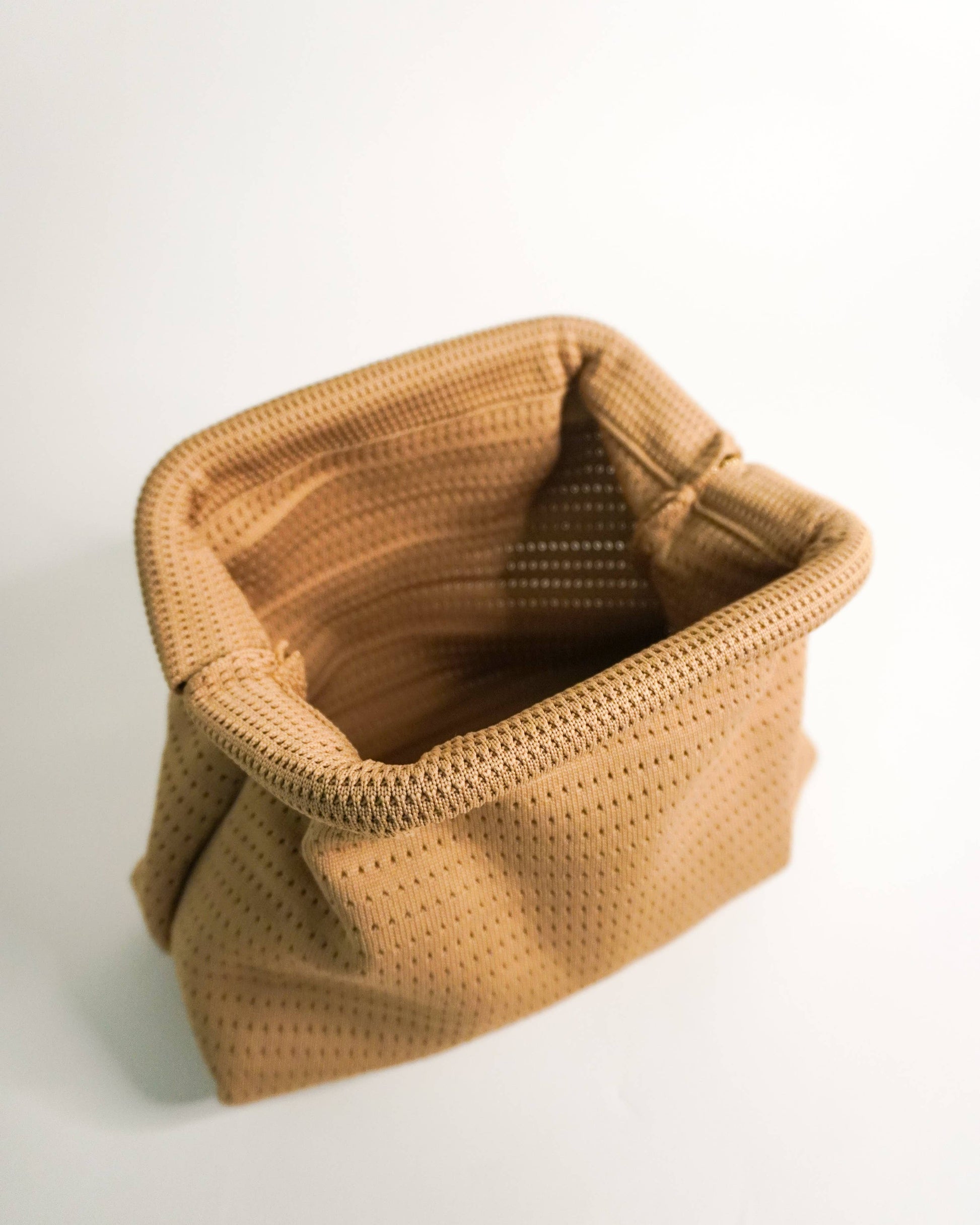 Brown woven basket on a white background