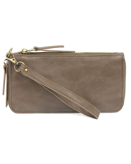 Mushroom vegan leather wallet with wrist strap against a white background. 