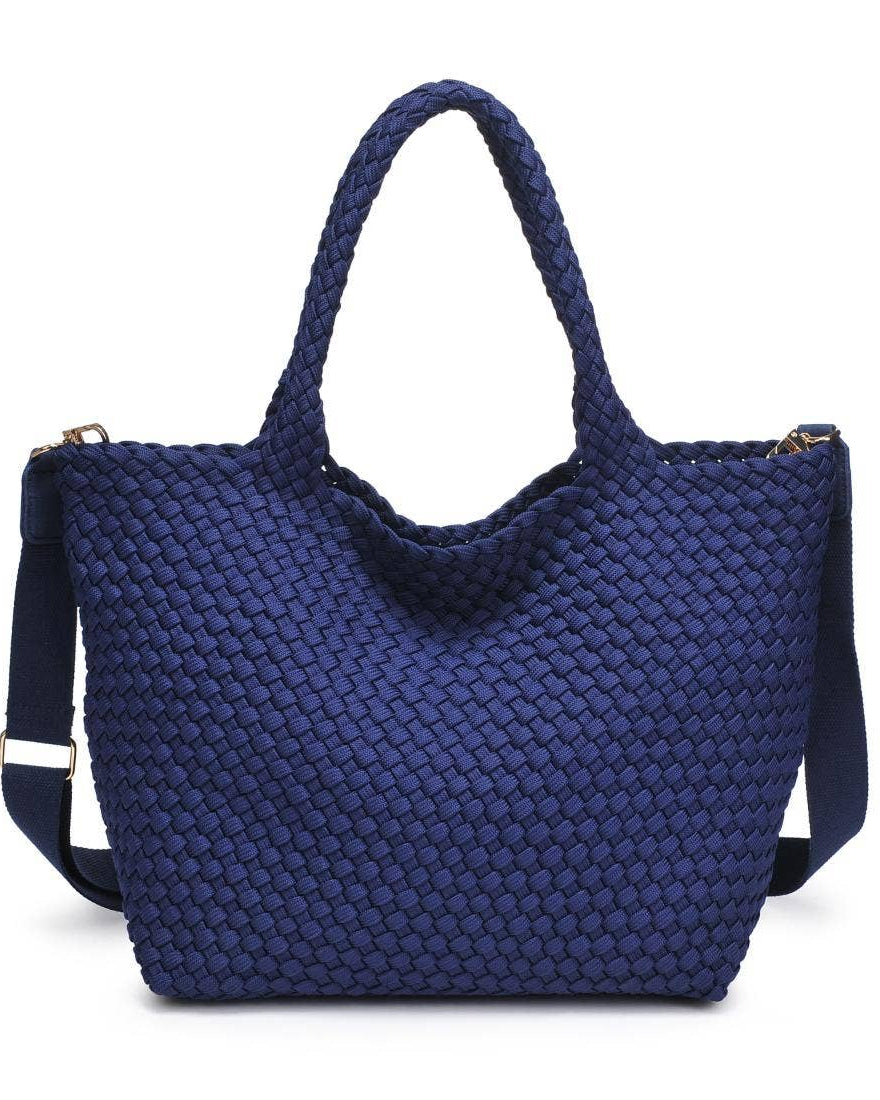 Blue woven handbag with a shoulder strap on a white background